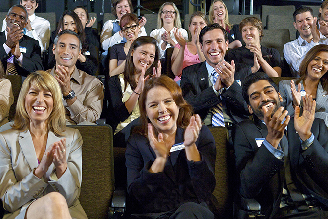 An engaged audience clapping.