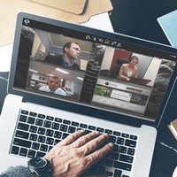 Laptop screen with video conferencing windows open.